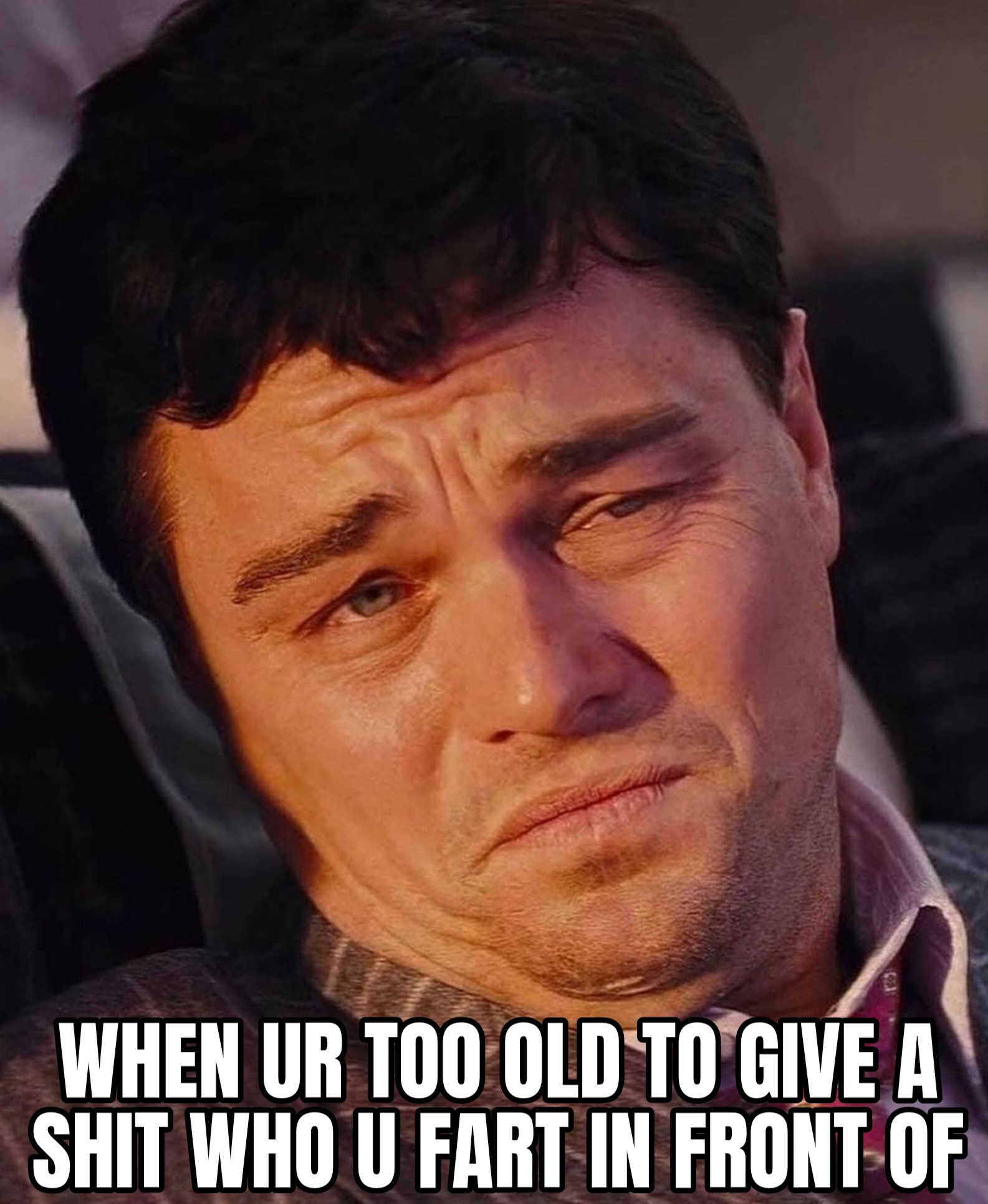 a meme of leonardo dicaprio leaning over with his neck tilted to the side and making a strenuous face as he is riding in a bus, and the meme says, when you're too old to give a shit who u fart in front of.