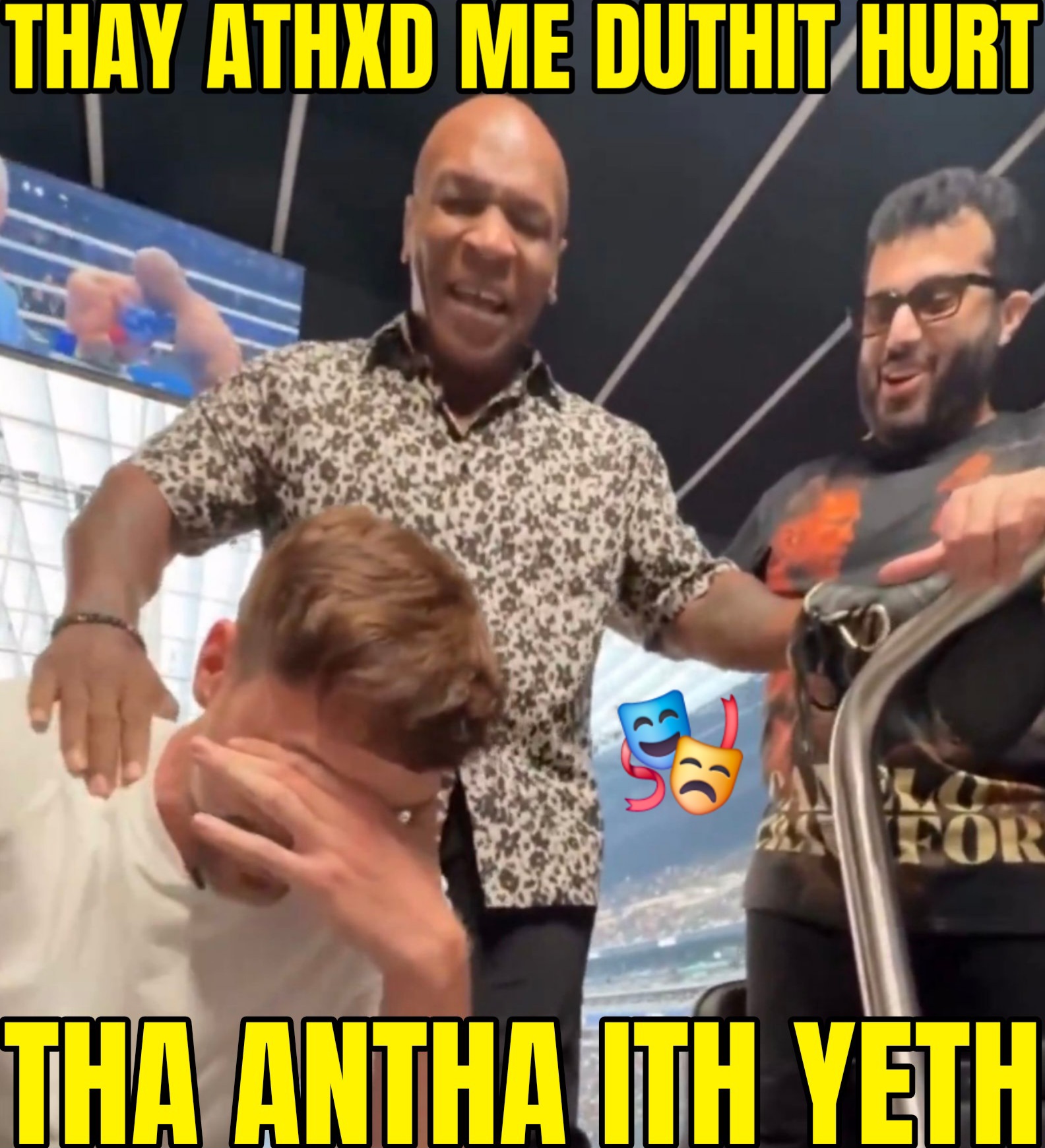 A meme of mike tyson after he punched jimmy mr beast donaldson in the stomach, and the text says, they asked me does it hurt, the answer is yes, and the text is stylized in mike tyson's signature lisp